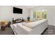 Bright and airy living room with large windows, plush seating, and stylish decor at 3718 Speer Blvd, Charlotte, NC 28217