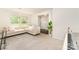 Bright living room with large windows, plush sofa and hardwood-look flooring at 3718 Speer Blvd, Charlotte, NC 28217