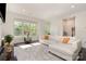 Beautiful living room with large windows offering natural light and a cozy, inviting atmosphere at 3718 Speer Blvd, Charlotte, NC 28217