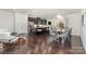 Open concept kitchen, dining and sitting area with island, modern lighting and stainless appliances at 3718 Speer Blvd, Charlotte, NC 28217