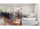 Open-concept living space with dining area, kitchen island and cozy seating at 3718 Speer Blvd, Charlotte, NC 28217