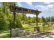 Renaissance Park entrance with wooden pergola and landscaping at 3718 Speer Blvd, Charlotte, NC 28217