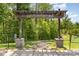 Renaissance Park entrance with wooden pergola and landscaping at 3718 Speer Blvd, Charlotte, NC 28217