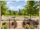 Neighborhood street view framed by front steps and greenery at 3718 Speer Blvd, Charlotte, NC 28217