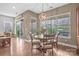 Bright breakfast nook with wood floors, a round table, and outdoor access at 423 Granite Lake Ct, Denver, NC 28037