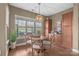 Cozy breakfast nook with wood floors, a round table, and backyard views at 423 Granite Lake Ct, Denver, NC 28037
