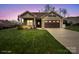 Charming home with well-maintained lawn, an American flag, and a two-car garage at 423 Granite Lake Ct, Denver, NC 28037