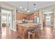 Spacious kitchen with an island, granite countertops, stainless steel appliances, and bar stool seating at 423 Granite Lake Ct, Denver, NC 28037