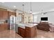 Kitchen with stainless steel appliances, granite counters, and view into the living room at 423 Granite Lake Ct, Denver, NC 28037