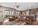 Open-concept living area flows to outdoor spaces offering seamless indoor/outdoor living with hardwood floors at 423 Granite Lake Ct, Denver, NC 28037