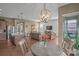 Open-concept living space with kitchen island and view into the living room at 423 Granite Lake Ct, Denver, NC 28037