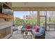 Cozy screened porch with comfortable seating and an outdoor view of the backyard at 423 Granite Lake Ct, Denver, NC 28037