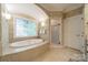 Elegant bathroom with a jacuzzi tub and a separate shower at 4646 Eagle Pointe Ct, Denver, NC 28037