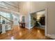 Inviting foyer with hardwood floors and an open staircase leading to a second-story landing at 4646 Eagle Pointe Ct, Denver, NC 28037