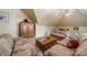 Spacious living room area featuring vaulted ceilings, plush sofas, wooden furniture, and carpet flooring at 4646 Eagle Pointe Ct, Denver, NC 28037