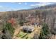 Arial view of the home from above with a nice lawn and the home's location in a wooded setting at 4793 Appaloosa Ln, Maiden, NC 28650