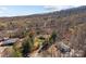 Aerial perspective of the property, highlighting the house, yard, and neighborhood in a wooded setting at 4793 Appaloosa Ln, Maiden, NC 28650