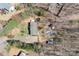 An aerial view of the property showing the house, backyard, surrounding trees, and driveway at 4793 Appaloosa Ln, Maiden, NC 28650
