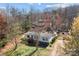 Aerial view of the home and property showing the home's position in a wooded environment at 4793 Appaloosa Ln, Maiden, NC 28650