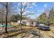 Backyard featuring a trampoline, swing set, and mature trees at 4793 Appaloosa Ln, Maiden, NC 28650