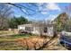View of a fenced backyard with mature trees and a trampoline at 4793 Appaloosa Ln, Maiden, NC 28650