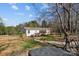 Backyard featuring a grill, fenced yard, mature trees and patio at 4793 Appaloosa Ln, Maiden, NC 28650