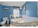Relaxing bathroom featuring a large soaking tub and ample natural light at 4793 Appaloosa Ln, Maiden, NC 28650