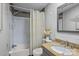 Bathroom featuring granite vanity, shower and tub with decorative shower curtain and accents at 4793 Appaloosa Ln, Maiden, NC 28650