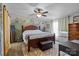 Comfortable bedroom featuring a large bed and mountain mural accent wall at 4793 Appaloosa Ln, Maiden, NC 28650