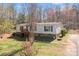 Exterior view of a well-maintained single-story home with a charming porch and a stone foundation at 4793 Appaloosa Ln, Maiden, NC 28650