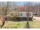 Well-maintained single-story home with a welcoming front porch, stone foundation, and a lush lawn at 4793 Appaloosa Ln, Maiden, NC 28650