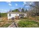 Exterior back view of a home with a grill on a small deck and small trampoline at 4793 Appaloosa Ln, Maiden, NC 28650