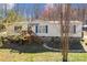 Exterior view of a single-story home with vinyl siding and a small wooden porch at 4793 Appaloosa Ln, Maiden, NC 28650