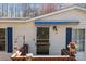 Close up of the home's front door that has a blue awning above it and a small porch at 4793 Appaloosa Ln, Maiden, NC 28650