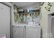 Cozy laundry room with modern washer and dryer, and decorative wall accents at 4793 Appaloosa Ln, Maiden, NC 28650