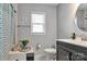 Bright bathroom with a modern vanity, round mirror, and ample natural light at 501 S Inman Ave, Bessemer City, NC 28016