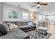 Cozy living room with sectional couch, ceiling fan and neutral colors at 501 S Inman Ave, Bessemer City, NC 28016