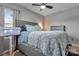 Light-filled main bedroom with ceiling fan, neutral tones, and soft, inviting decor at 501 S Inman Ave, Bessemer City, NC 28016