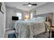 Comfortable main bedroom featuring ceiling fan, soft lighting, and a cozy, inviting atmosphere at 501 S Inman Ave, Bessemer City, NC 28016