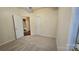 Bright bedroom with neutral carpet, ceiling fan, and two closets for ample storage at 5016 Haybridge Rd, Charlotte, NC 28269