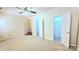 Airy bedroom boasts a ceiling fan, neutral carpet, and closet access offering comfortable living at 5016 Haybridge Rd, Charlotte, NC 28269