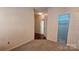 Neutral bedroom with carpeted floors, and closet storage for an organized and comfortable living space at 5016 Haybridge Rd, Charlotte, NC 28269