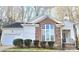 Charming single-story home with brick accents, a two-car garage, and a welcoming entrance at 5016 Haybridge Rd, Charlotte, NC 28269