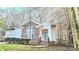 Attractive single-story home with brick details, an attached garage, and a quaint front porch at 5016 Haybridge Rd, Charlotte, NC 28269