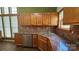Charming kitchen with granite countertops, stainless steel appliances, and ample wood cabinetry at 5016 Haybridge Rd, Charlotte, NC 28269