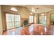 Spacious living area featuring hardwood floors, a fireplace, and sliding glass doors to outdoor views at 5016 Haybridge Rd, Charlotte, NC 28269