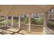 Inviting screened porch with wood flooring and views of the surrounding landscape at 5016 Haybridge Rd, Charlotte, NC 28269