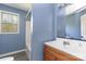 Bathroom featuring a sink, mirror, bathtub and window at 518 W Westview St, Gastonia, NC 28052