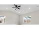 Cozy bedroom with neutral walls, ample natural light, and a ceiling fan at 5611 Skinny Down, Charlotte, NC 28215