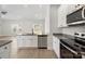 Contemporary kitchen with stainless steel appliances, granite countertops, and an open layout at 5611 Skinny Down, Charlotte, NC 28215